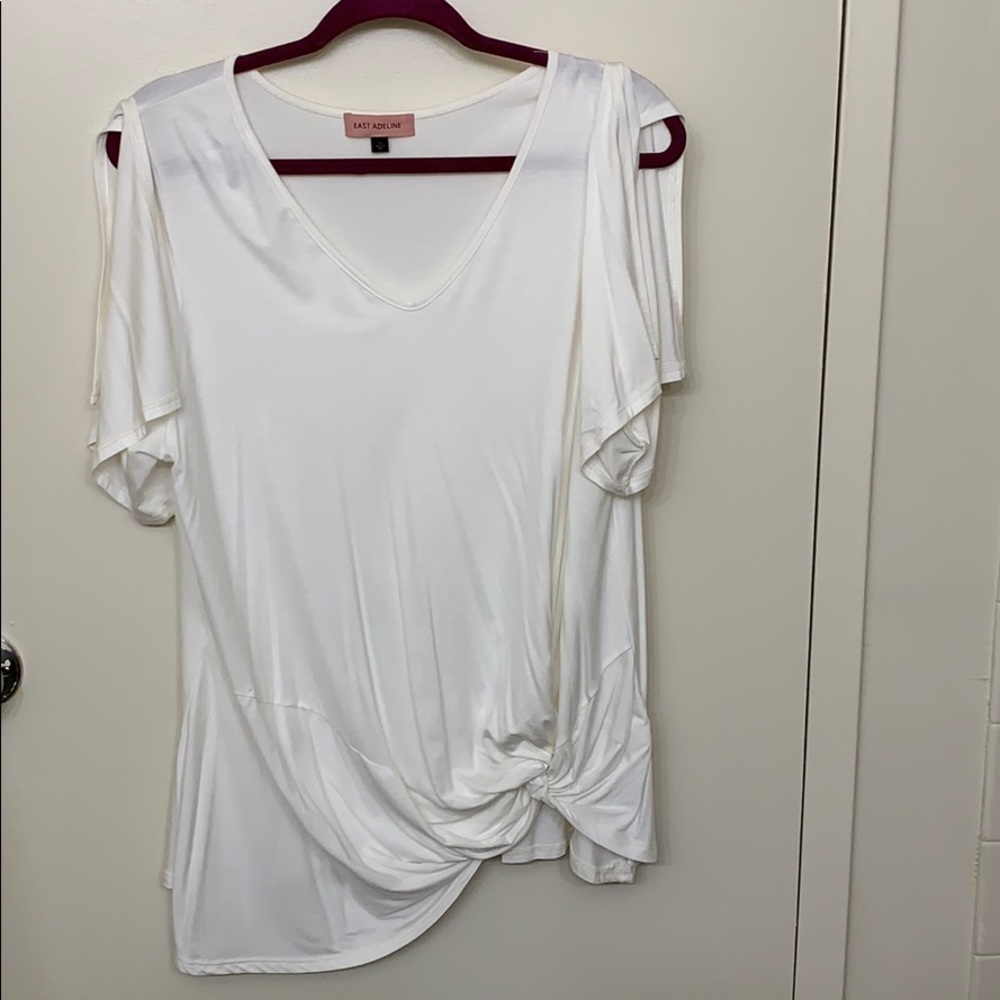 white blouse with open slit sleeves